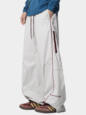 STRIPED CURVED CUT PANTS